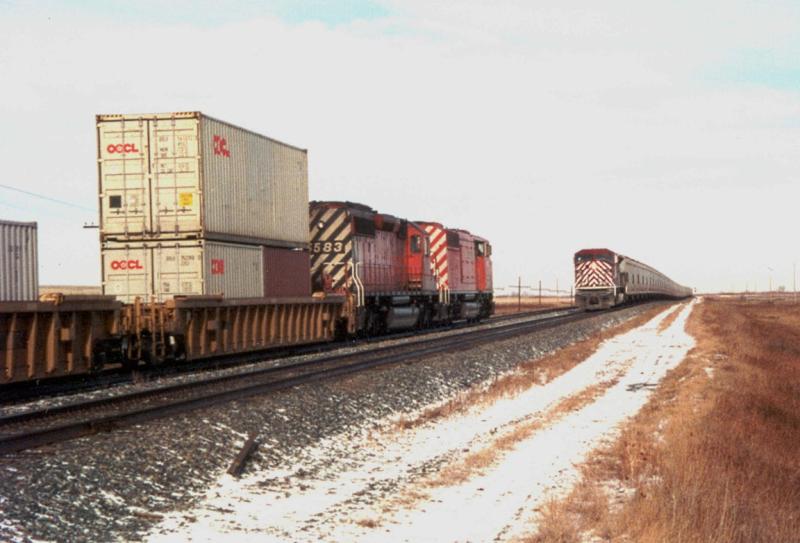 CEFX 106 meets a train in Caron SK