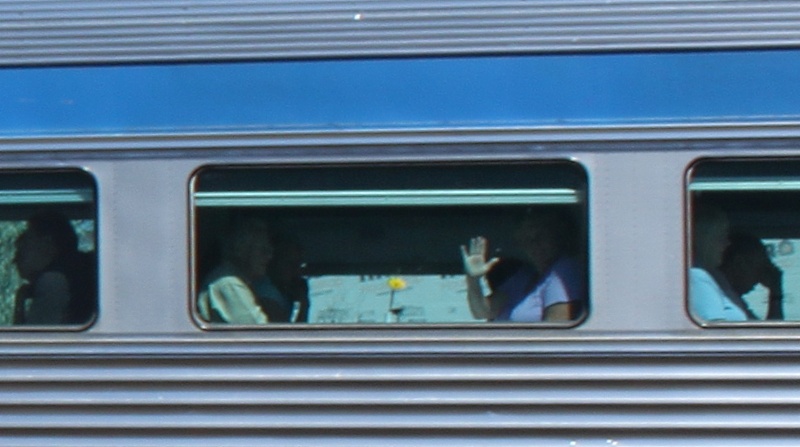 Wave from diner aboard train