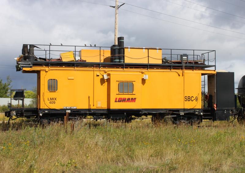 Caboose SBC-9 with Loram ballast cleaner in Winnipeg